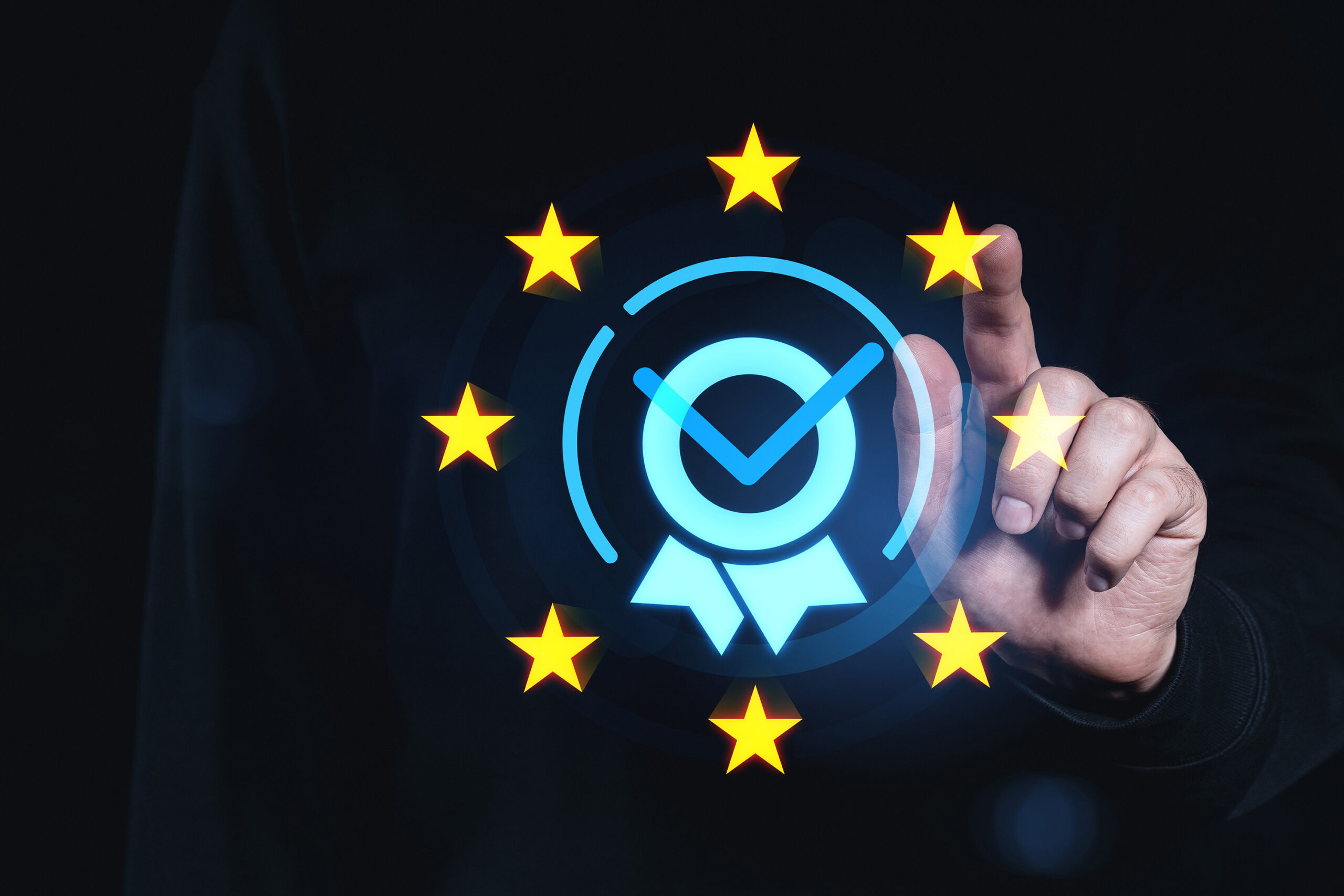 A hand ticking a digital tick box in a ring of stars.
